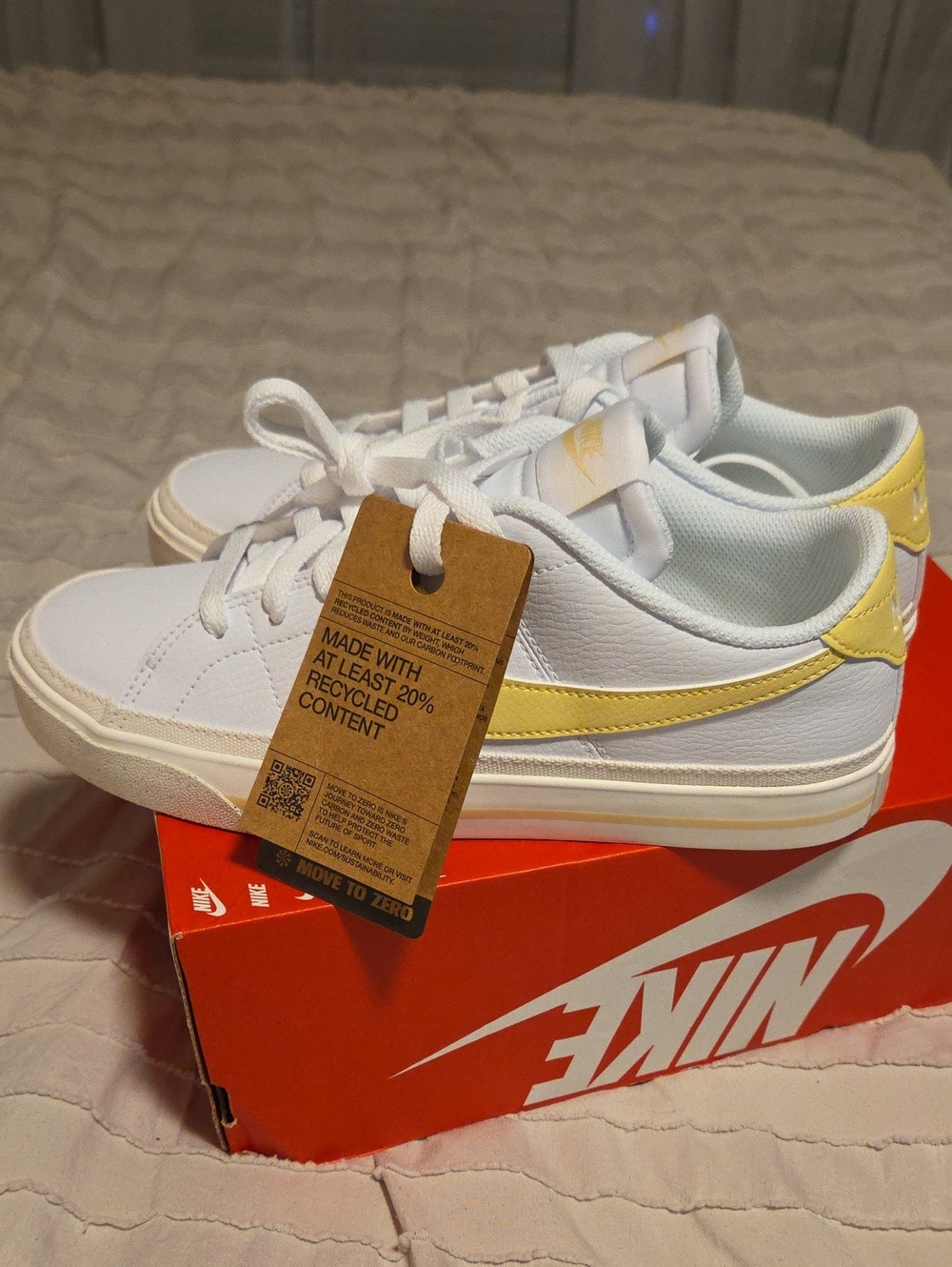 Nike White Sneakers with Pale Yellow Swoosh